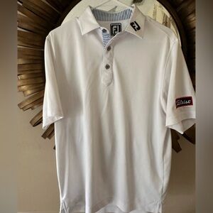 White FootJoy golf button down shirt with Titleist logo